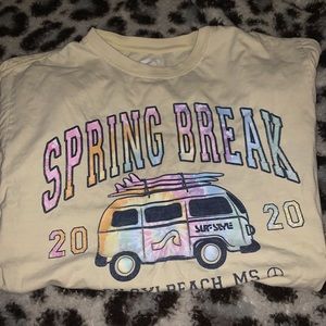 medium sized yellow t shirt with graphics on the front